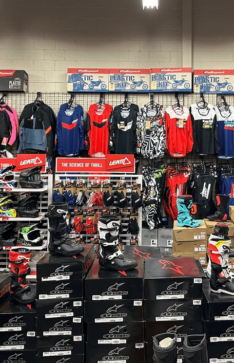 The gear room at ORPS Parts, Newmarket: Jerseys, helmets, boots and riding gear